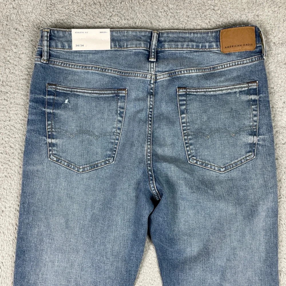 American Eagle Jeans Mens 34x34 Blue Athletic Fit Distressed Stretch Airflex NEW